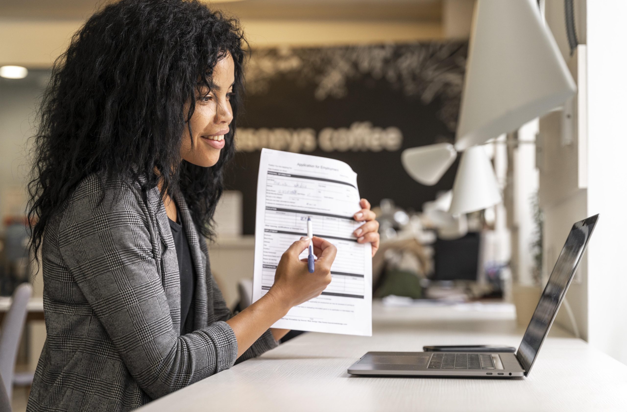 medium shot woman showing contract